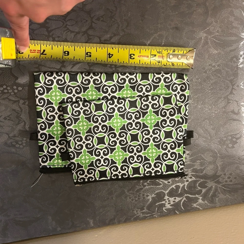 Sassy & Chic cosmetic bags featuring a green, black, and white geometric tile